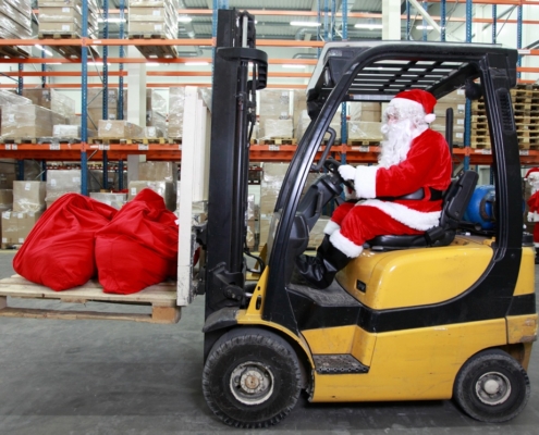 Santa Claus driving a forklift