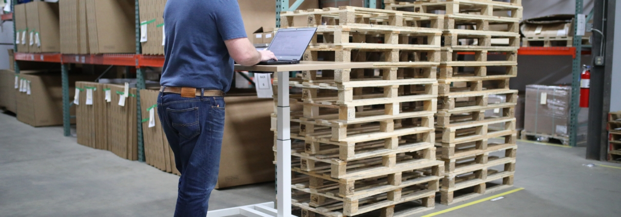 Man at laptop entering data for sustainability ratings