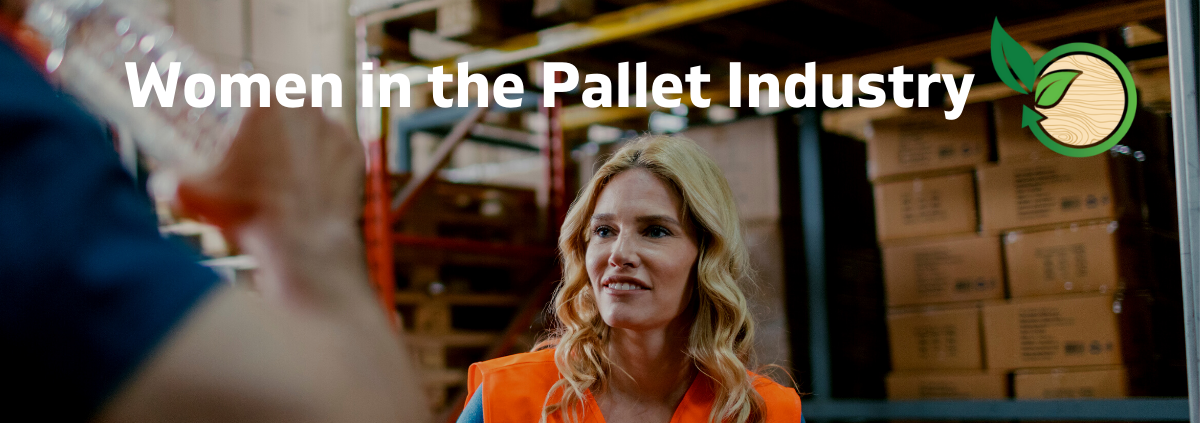 Woman in a warehouse standing next to pallets and racks